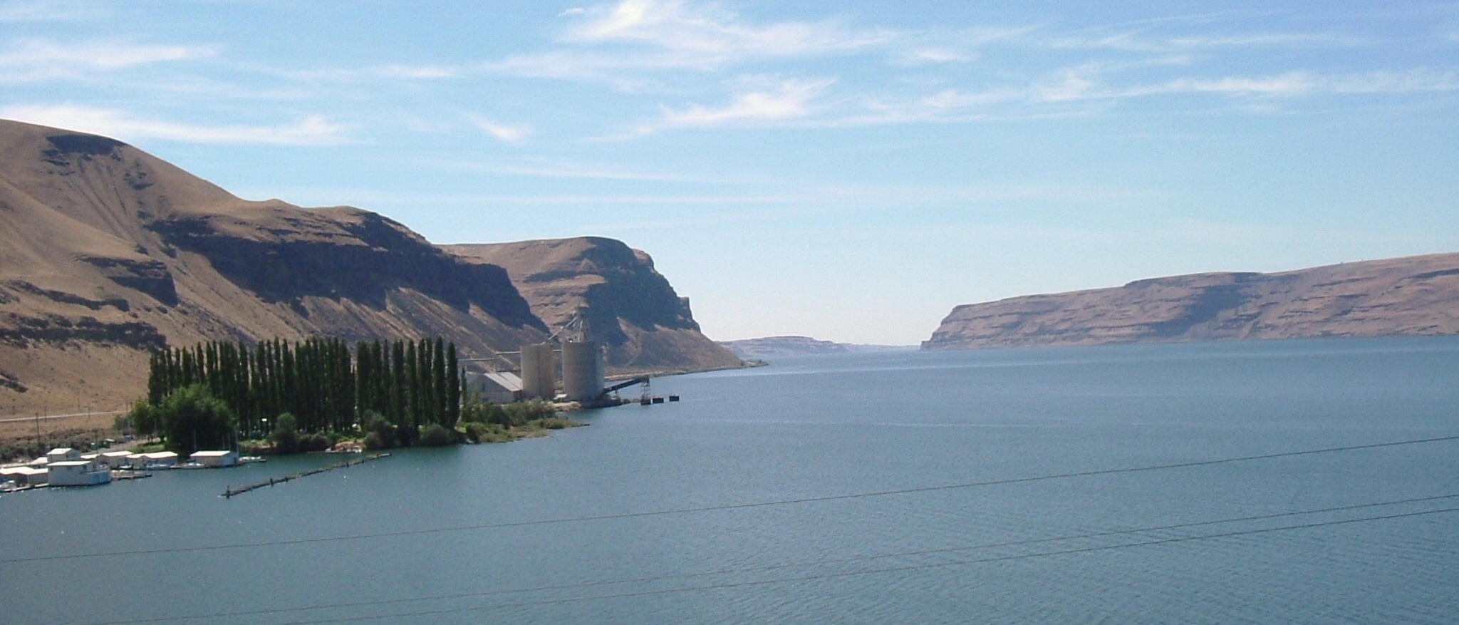 The Columbia River passing through Wallula Gap, water framed by tall basalt cliffs on both banks